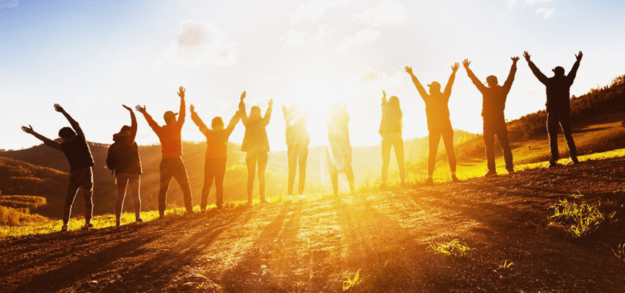a large group greeting the sun