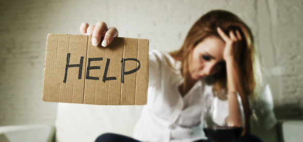 alcohol-awareness-header woman holding up sign reading Help