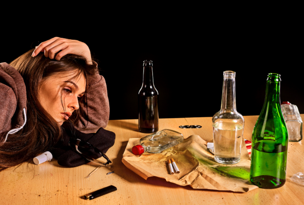 woman looking at liquor bottles
