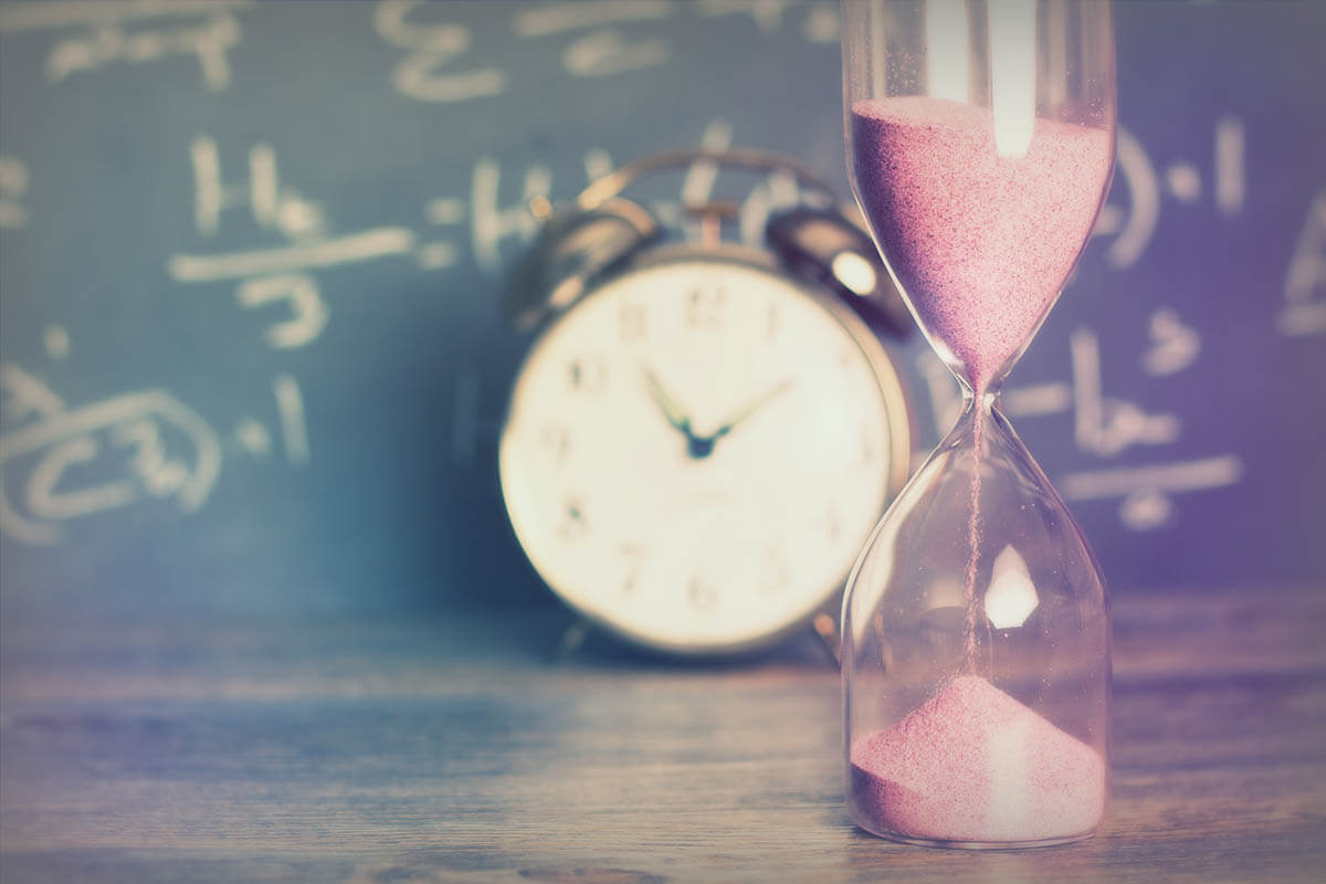 hourglass and clock showing how to practice patience