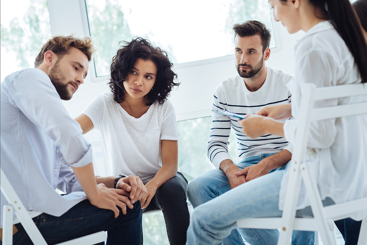 addiction recovery (1) group discussing the stages of addiction recovery