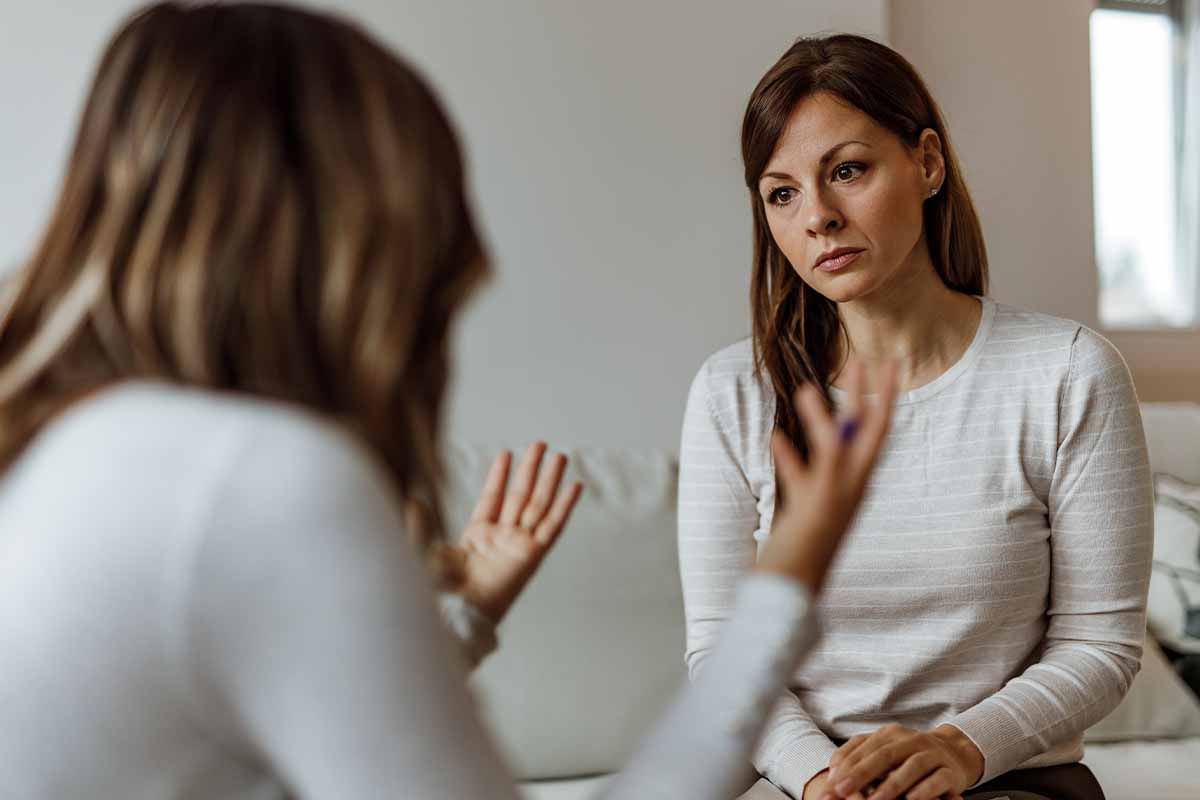 a woman is told about the benefits of a womens rehab center