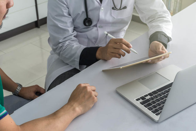 doctor and client discussing addiction recovery centers