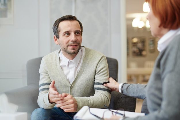 therapist and client discussing opiate treatment