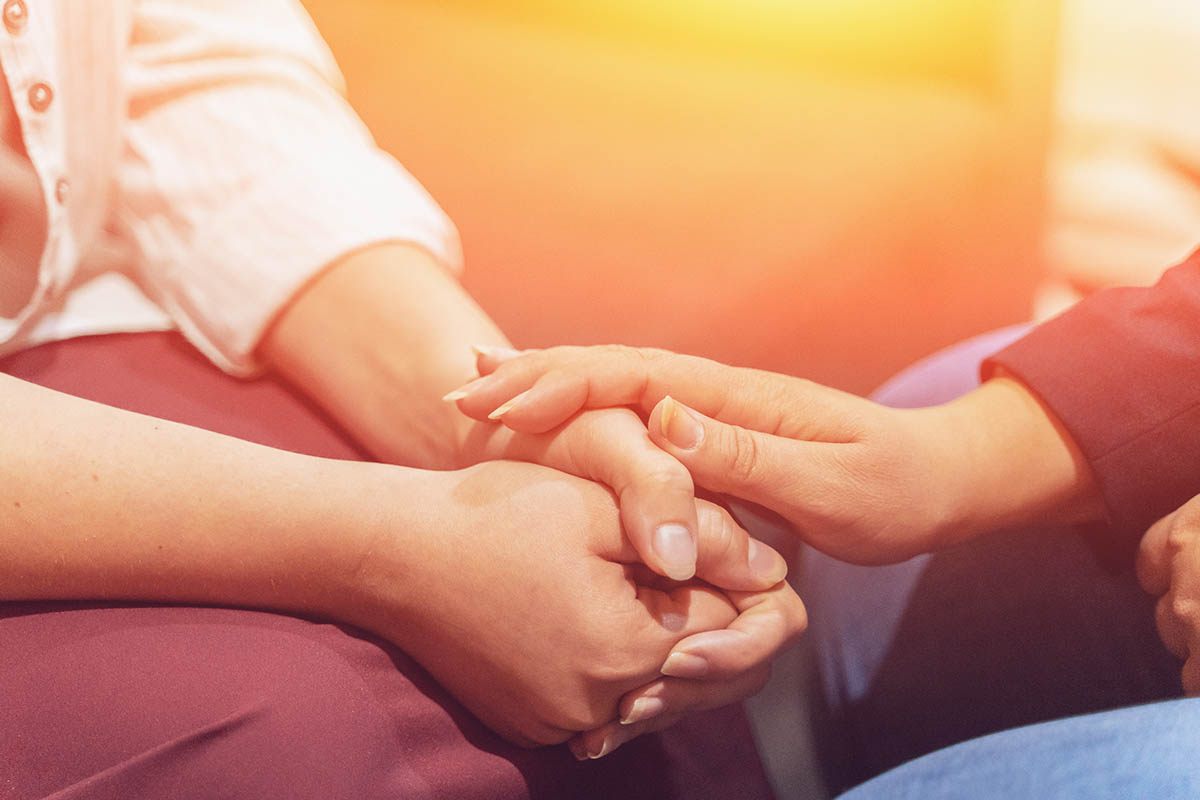 two individuals discussing inpatient alcohol rehab