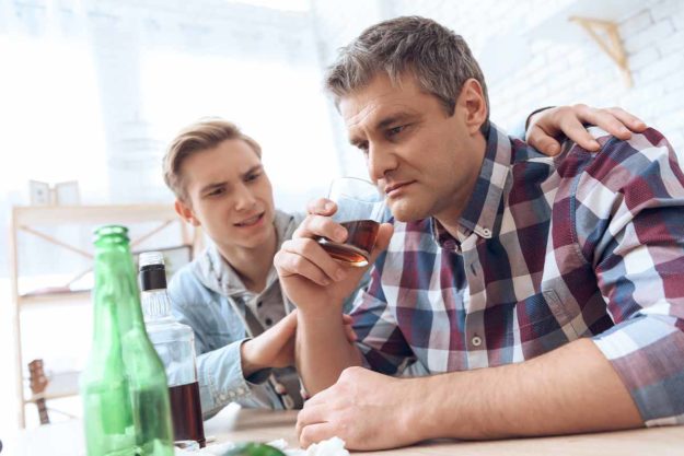 Man talks to a loved one about alcohol rehab