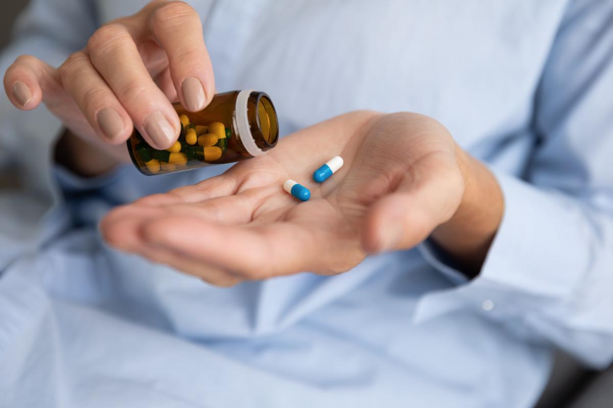 5 Signs You Need Prescription Drug Treatment pills in hand representing 5 Signs You Need Prescription Drug Treatment