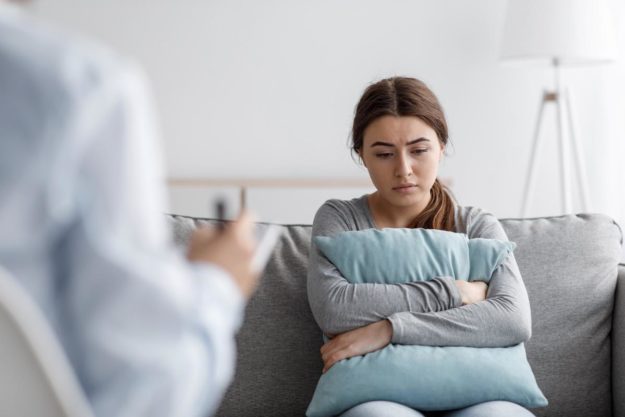 Xanax Addiction- The Dangers, Side Effects, and Treatment woman in therapy session for xanax addiction