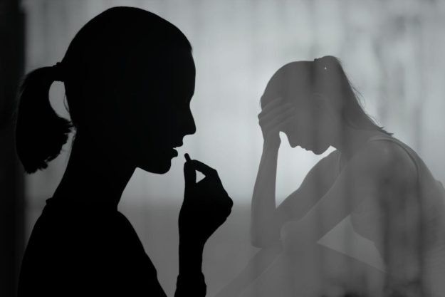 Signs of Opioid Abuse a woman thinking about when she took a pill and the signs of opioid abuse